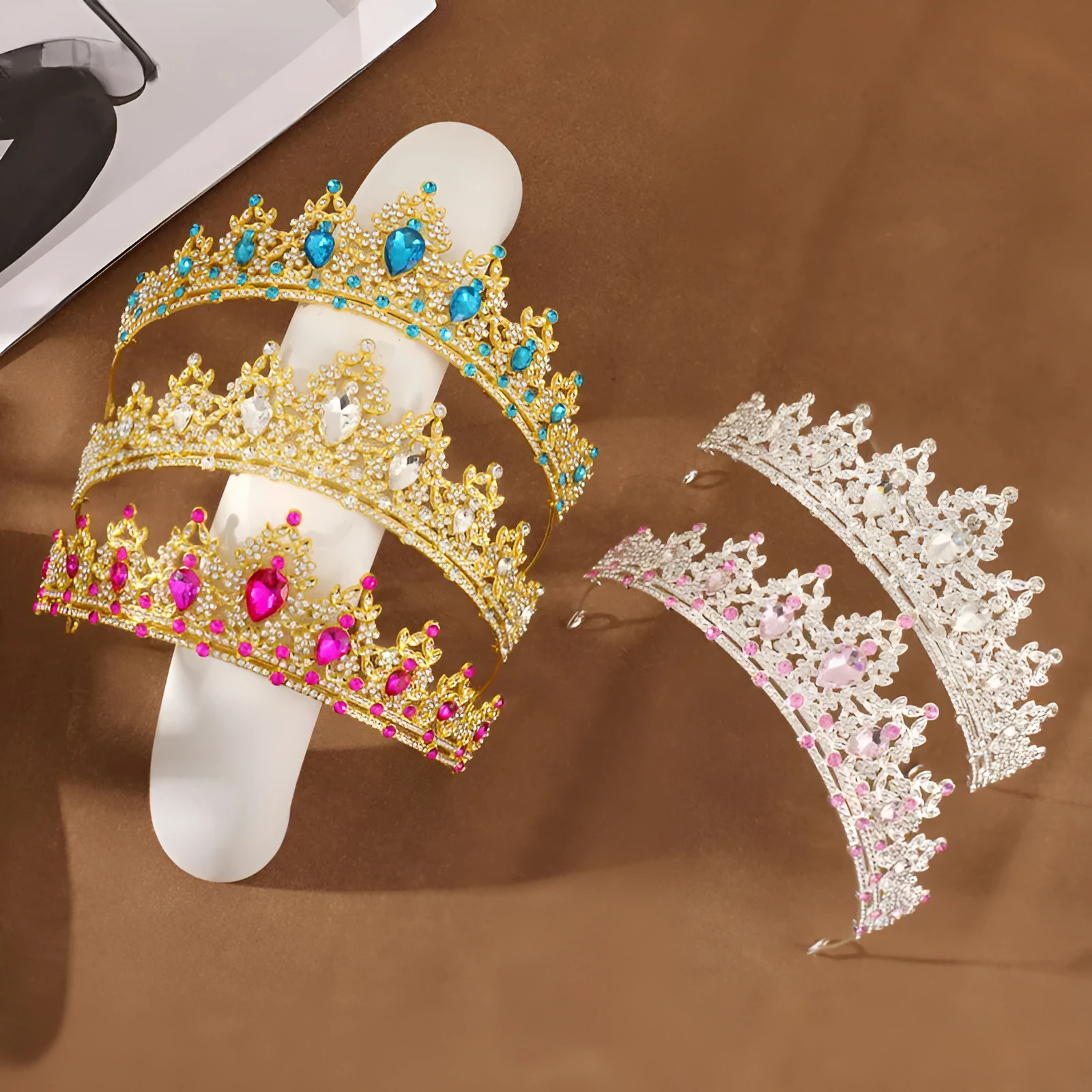 Gold alloy crown-shaped wedding hair headdress with electroplated finish on neutral background
