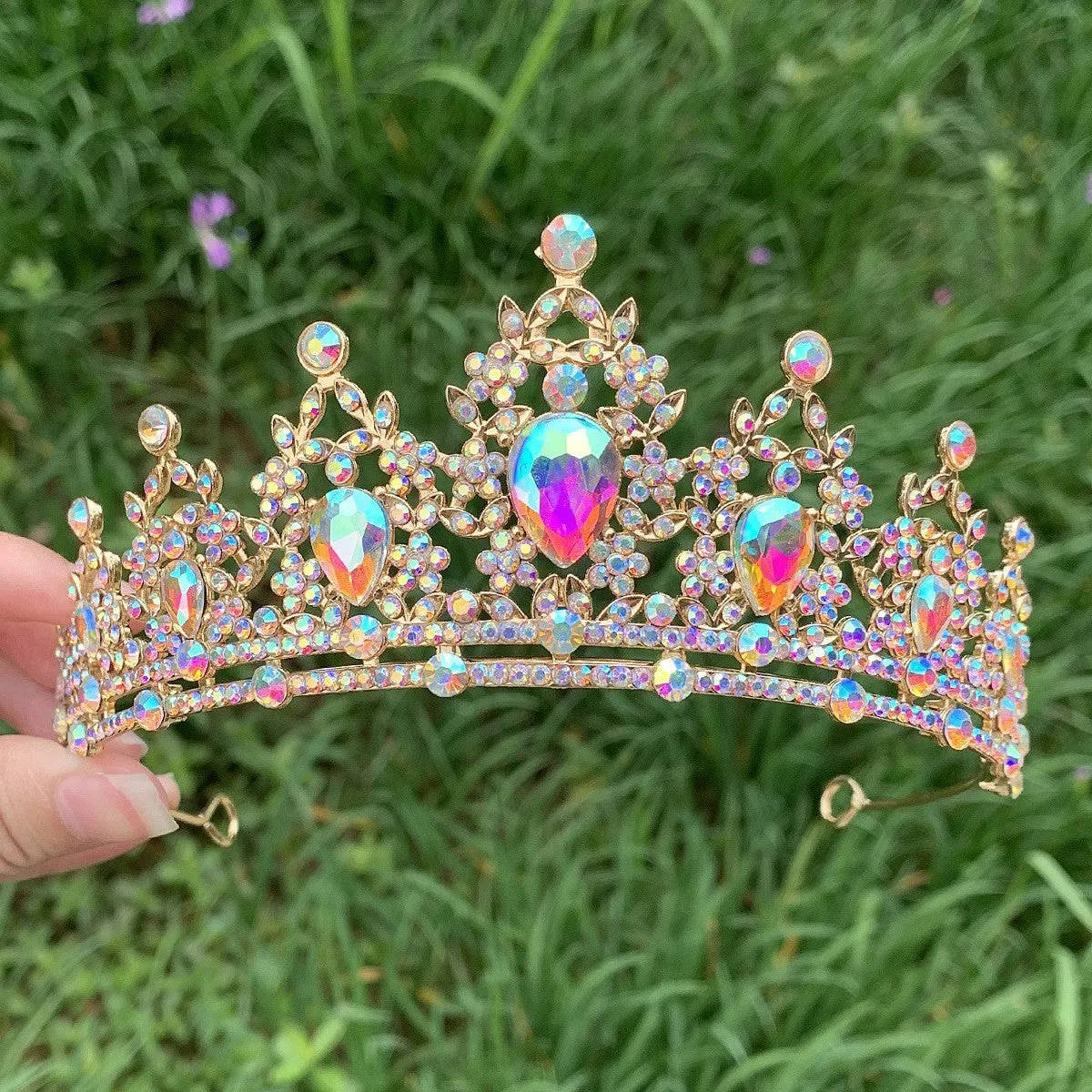 Gold alloy crown-shaped wedding hair headdress with electroplated finish on neutral background