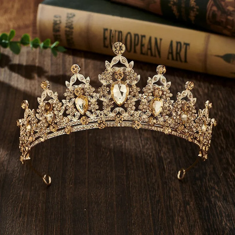 Gold alloy crown-shaped wedding hair headdress with electroplated finish on neutral background