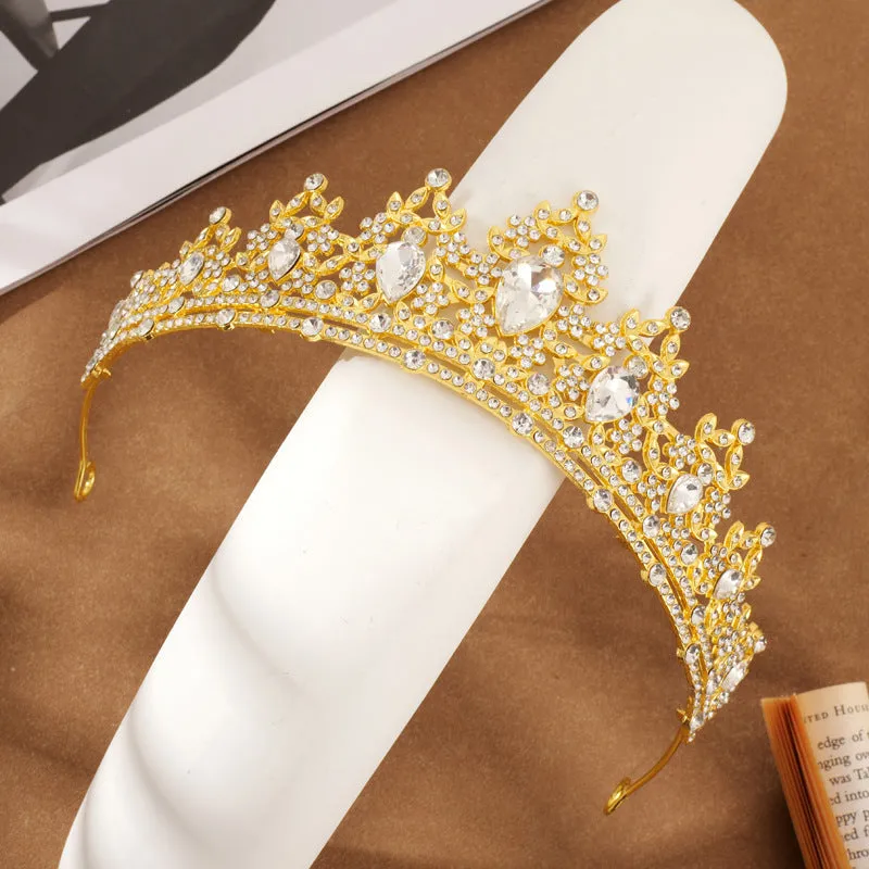 Gold alloy crown-shaped wedding hair headdress with electroplated finish on neutral background
