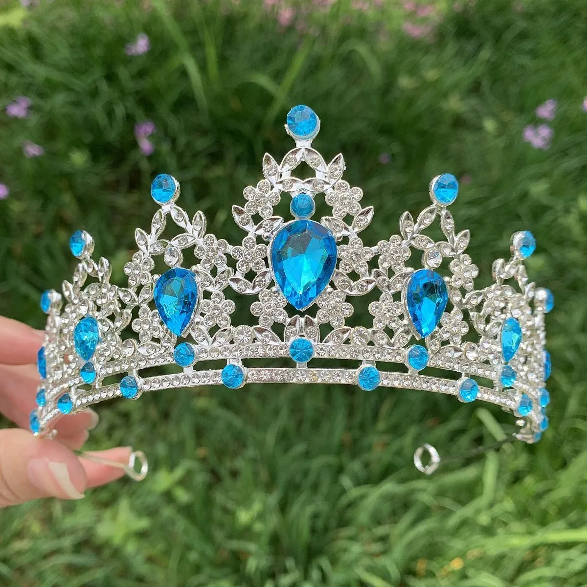 Gold alloy crown-shaped wedding hair headdress with electroplated finish on neutral background