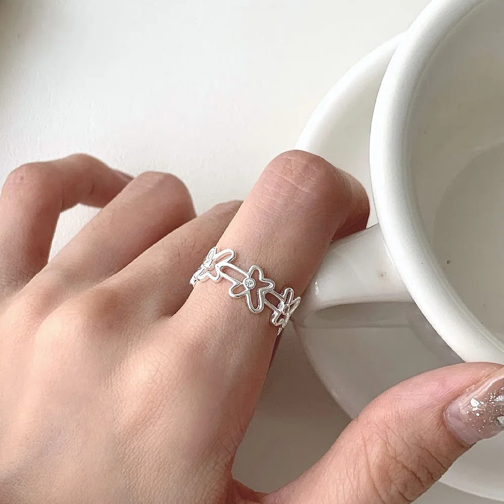 S925 sterling silver irregular hollow-out flower ring with adjustable opening in silver colour