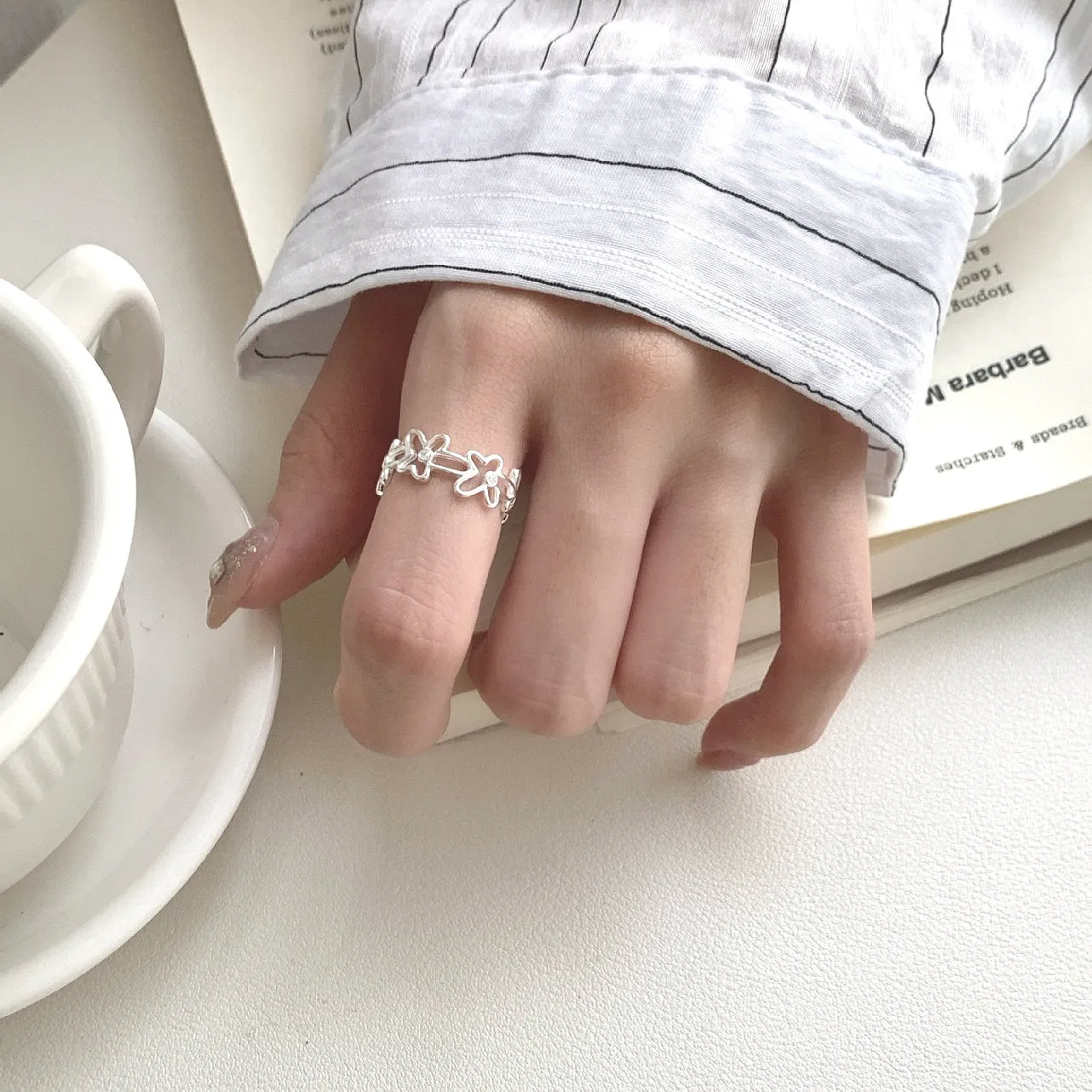 S925 sterling silver irregular hollow-out flower ring with adjustable opening in silver colour