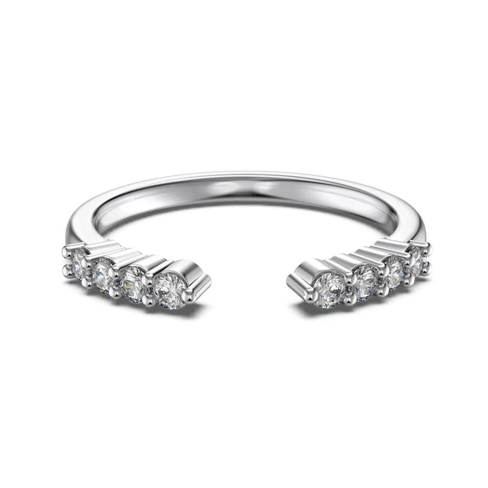 Sterling silver open ring with irregular wave design and adjustable opening on female hand