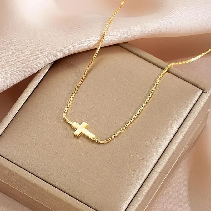 Miniature cross pendant necklace for women in alloy, dainty style on display