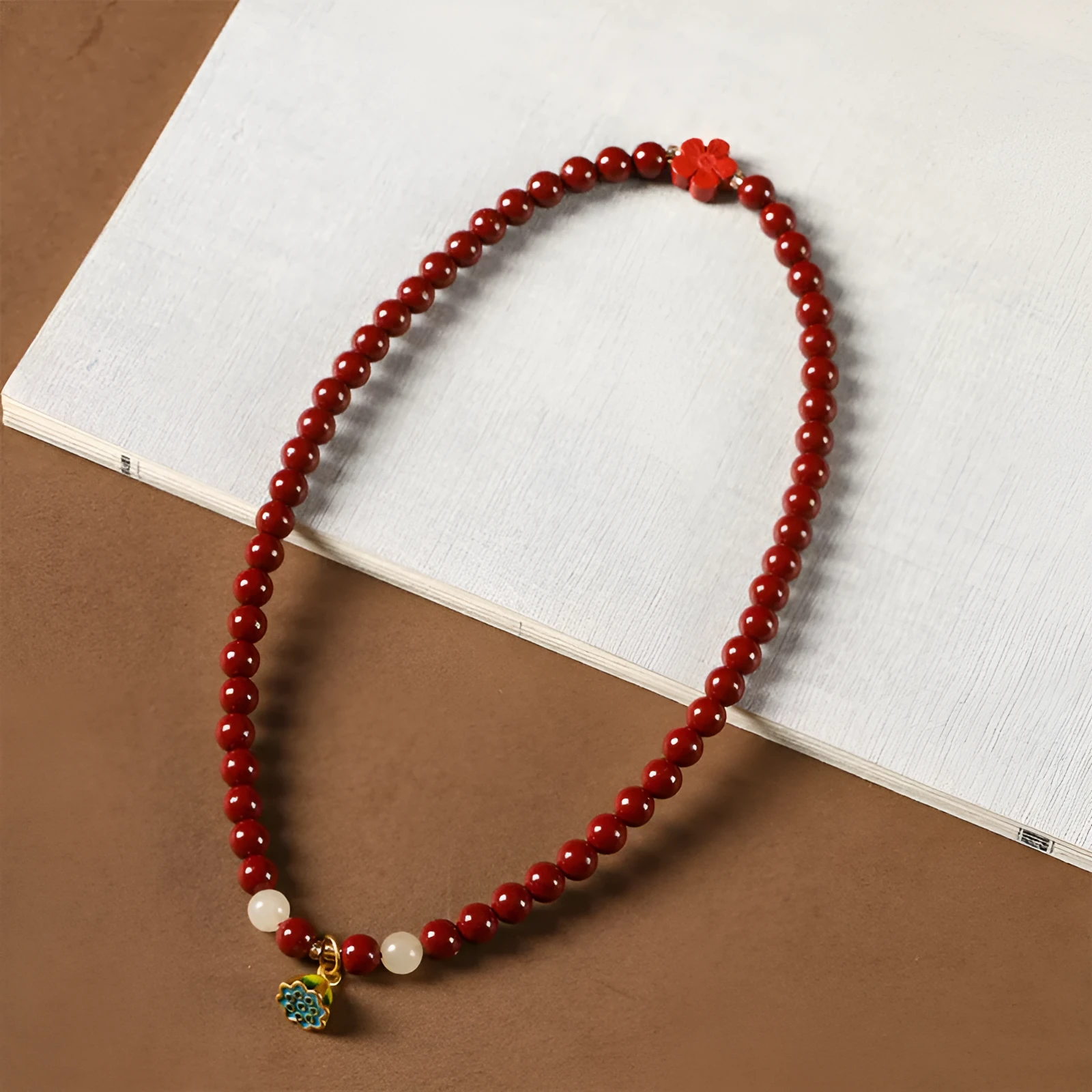 Purple gold sand bracelet with lotus seedpod centre and double circle bead design on adjustable string.