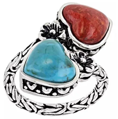 Silver bubble ring with eight-leaf green agate stone on a plain background