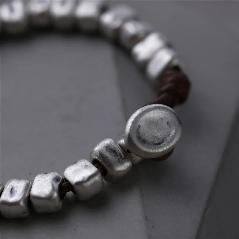 Women's handmade silver bracelet with wooden irregular square design on elasticated band