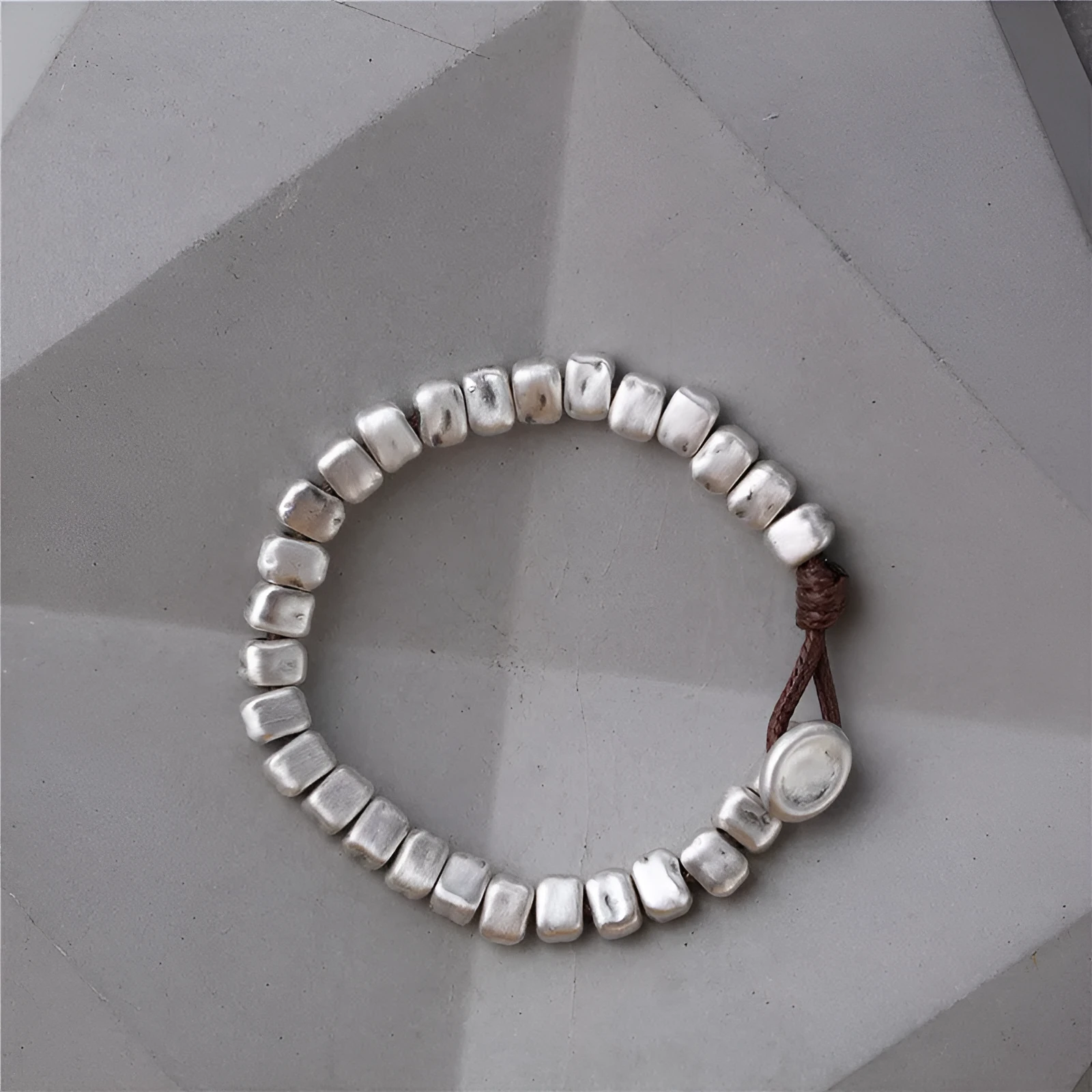 Women's handmade silver bracelet with wooden irregular square design on elasticated band
