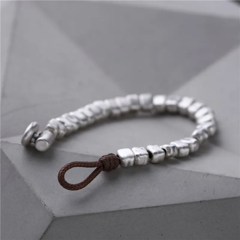 Women's handmade silver bracelet with wooden irregular square design on elasticated band