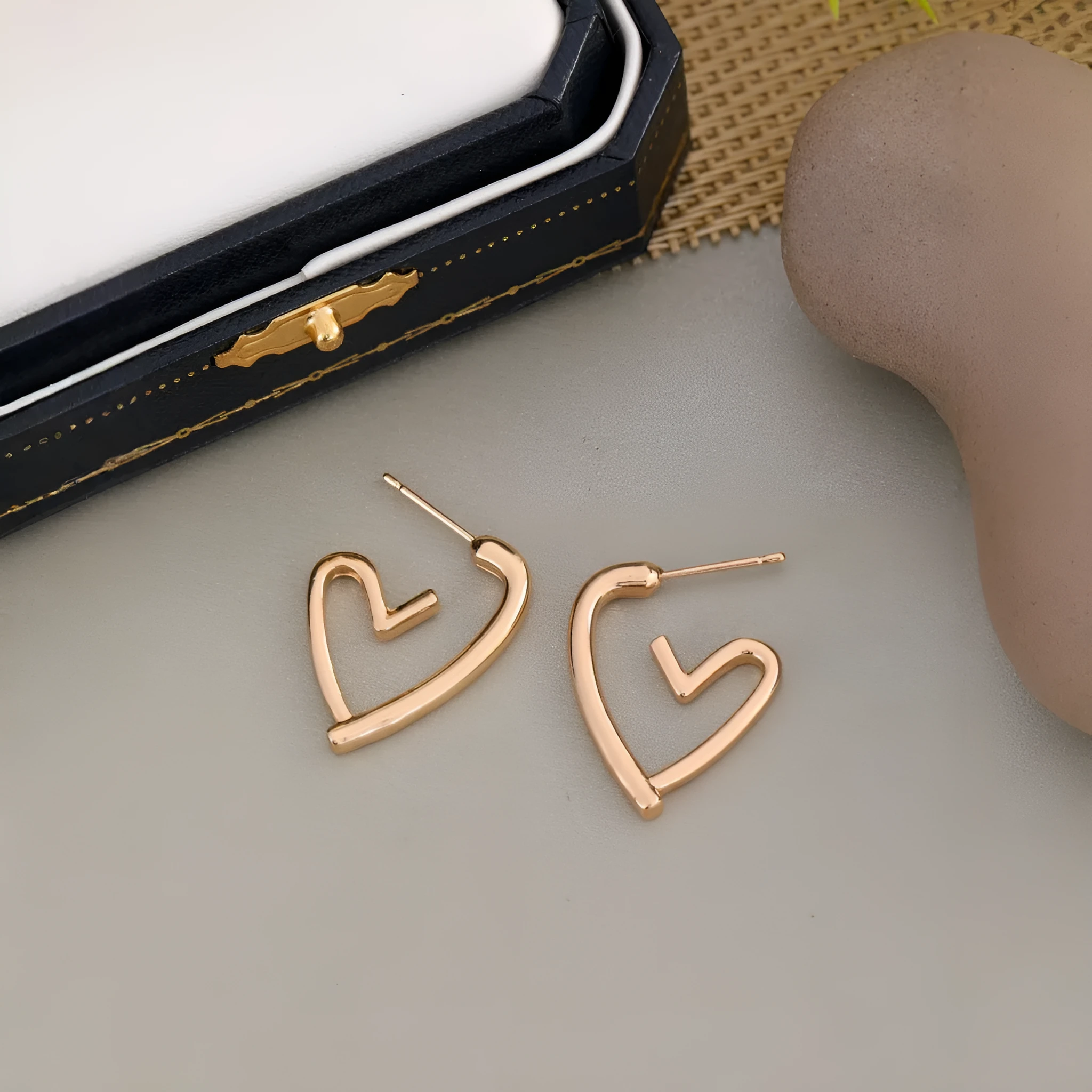 Simple cold style love earrings for women in gold colour metal stud earrings