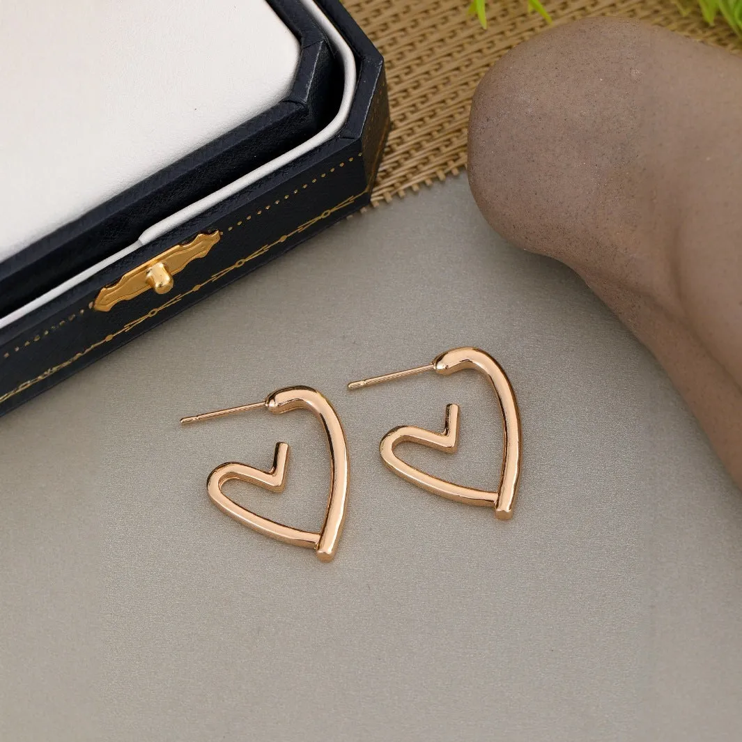 Simple cold style love earrings for women in gold colour metal stud earrings
