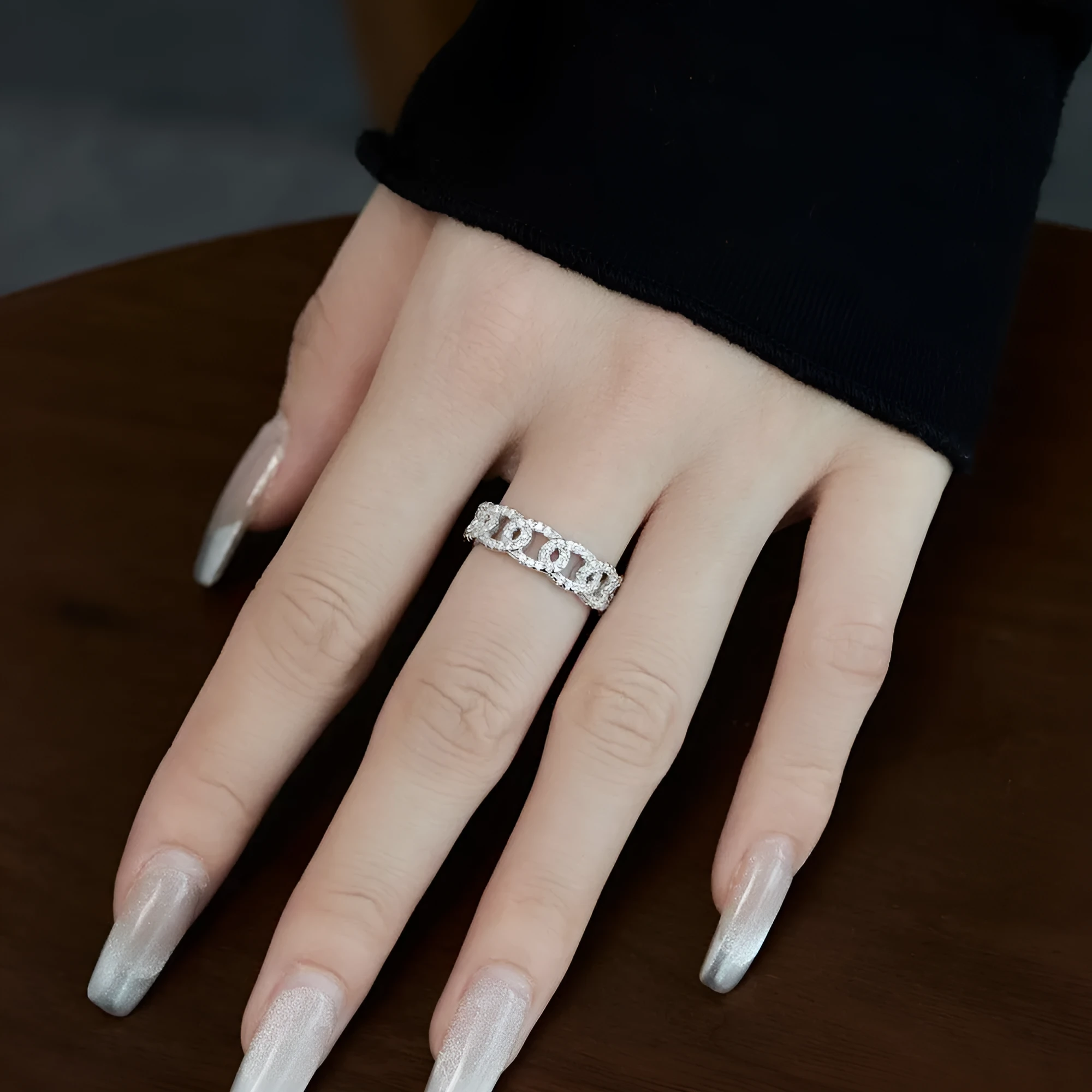 Silver punk chain ring for women with electroplated finish on white background