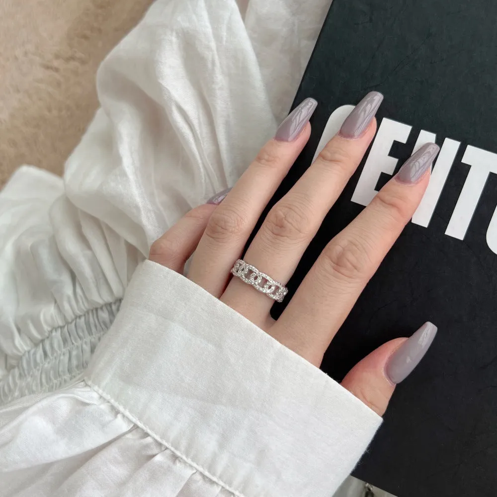 Silver punk chain ring for women with electroplated finish on white background