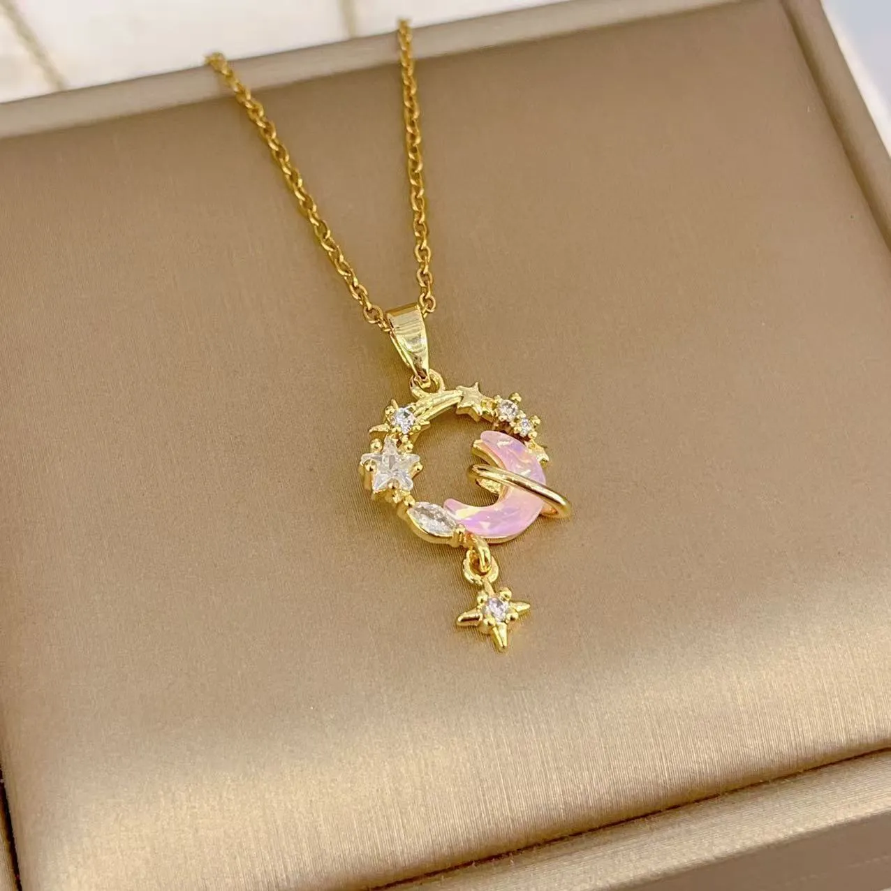 Gold electroplated copper necklace with micro-inlaid zirconium moon pendant on O-ring chain