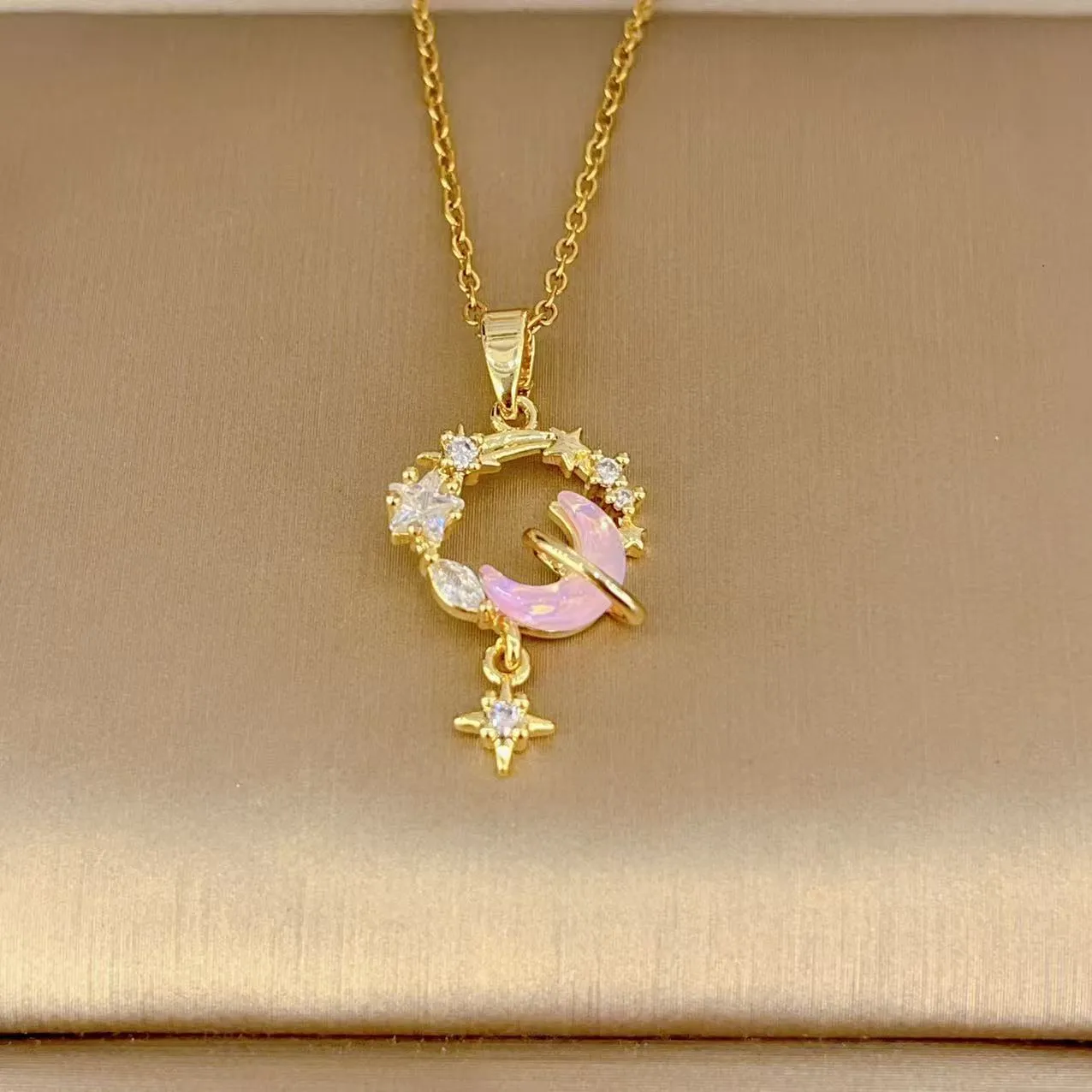 Gold electroplated copper necklace with micro-inlaid zirconium moon pendant on O-ring chain