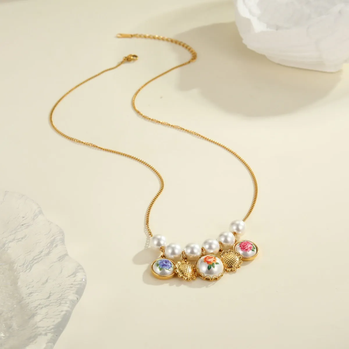 Vintage sunflower stainless steel necklace with 18K gold electroplated finish on display