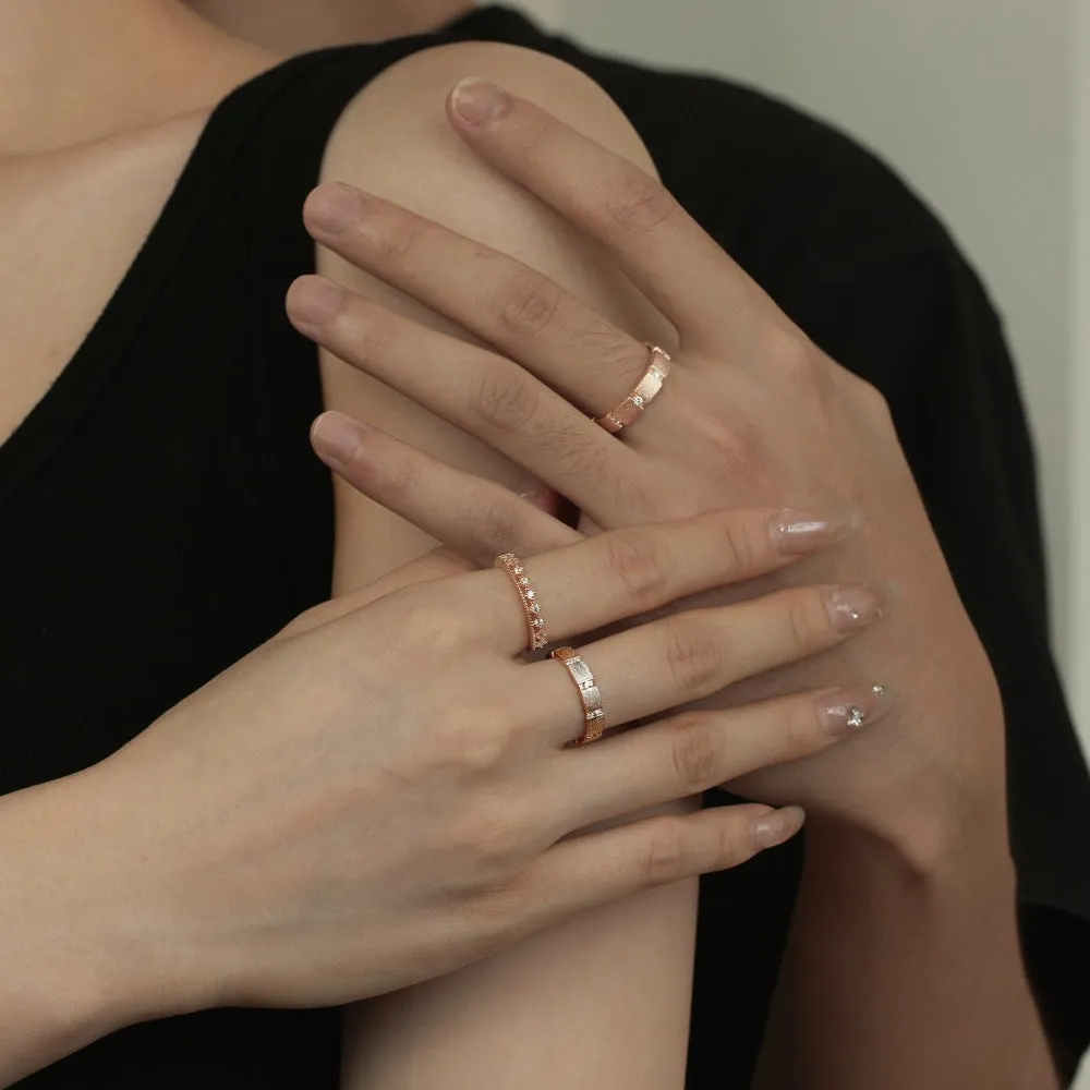 S925 sterling silver slim couple ring with geometric drill detail, champagne colour, on white background
