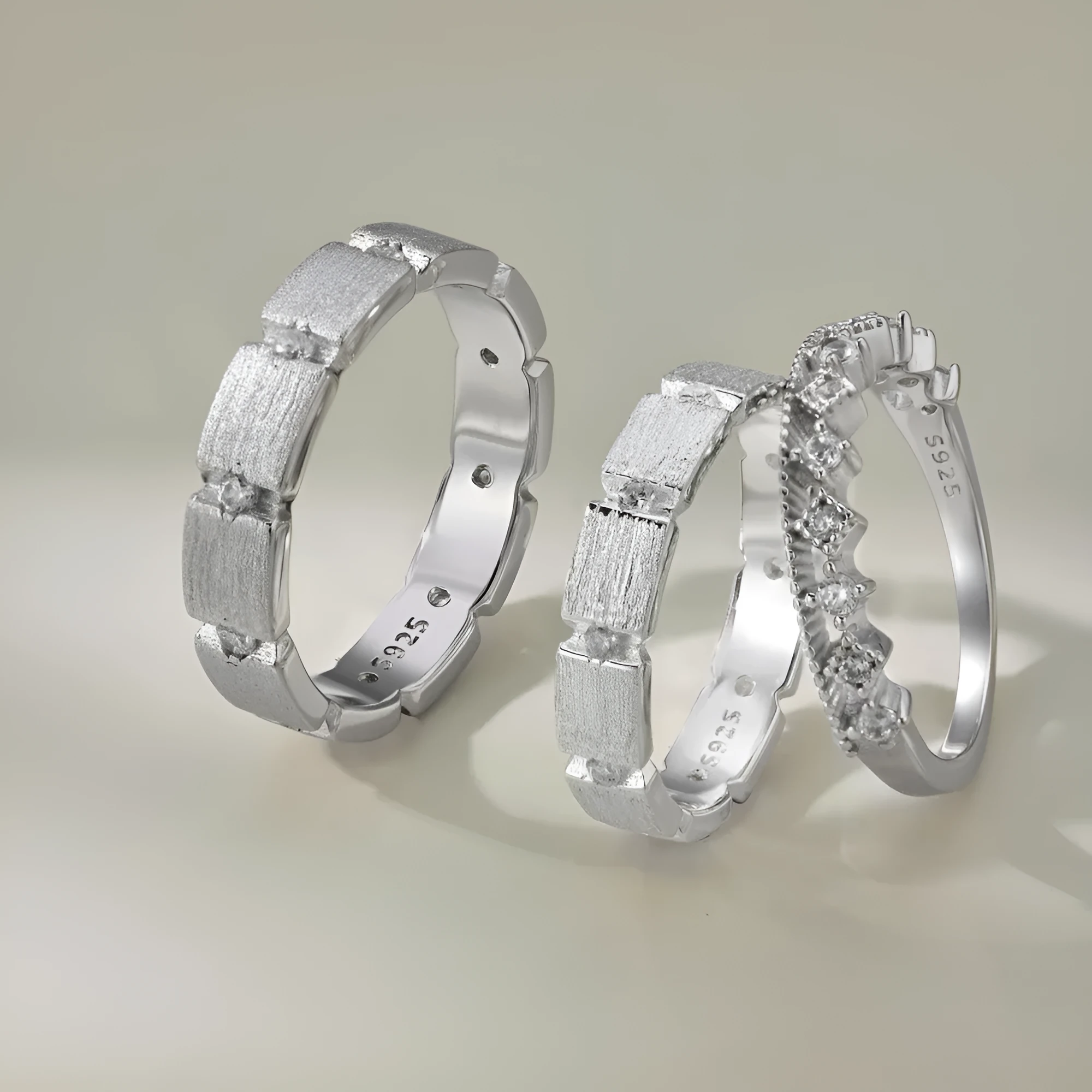 S925 sterling silver slim couple ring with geometric drill detail, champagne colour, on white background