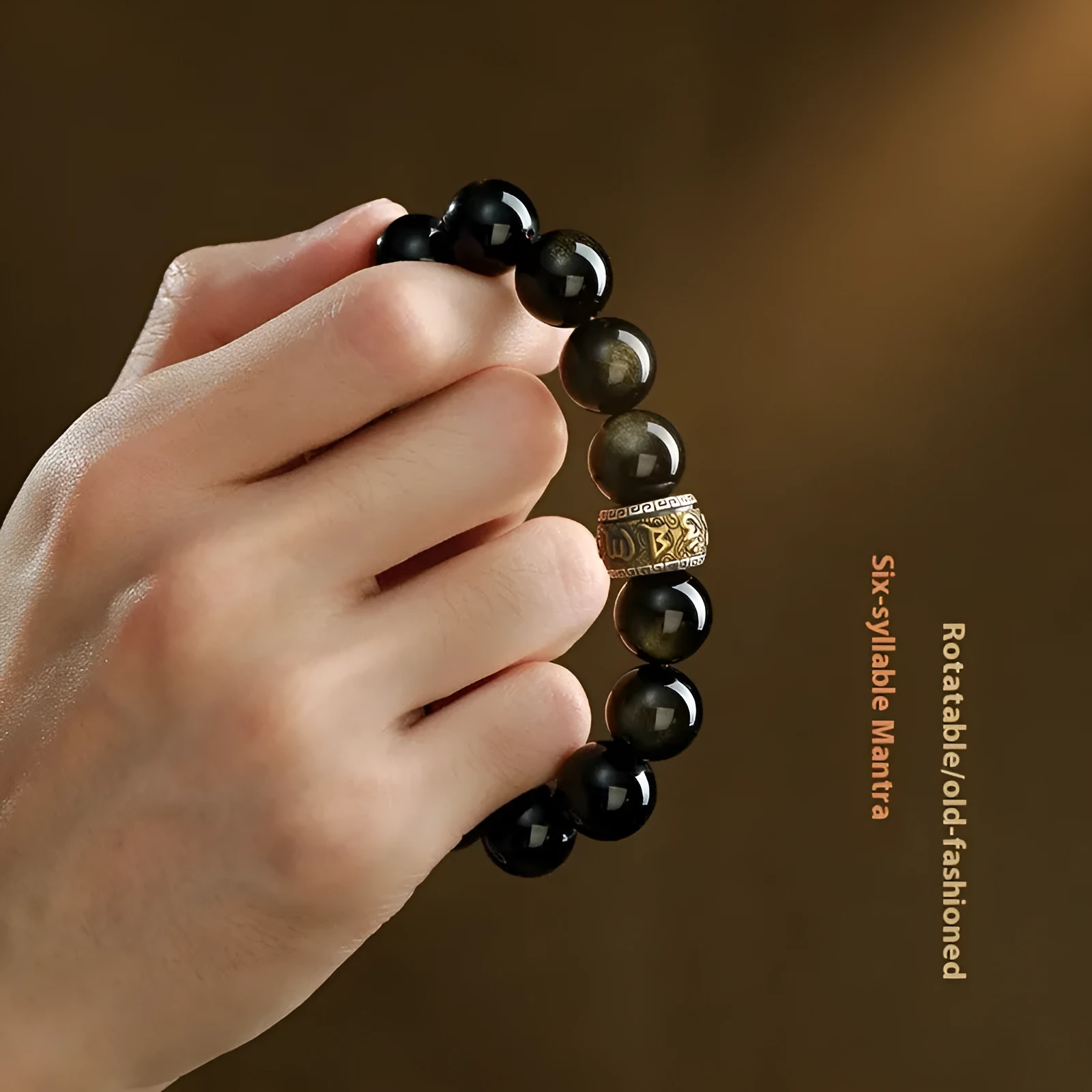 Carved cinnabar beads bracelet with gold obsidian animal zodiac design on a gift box.
