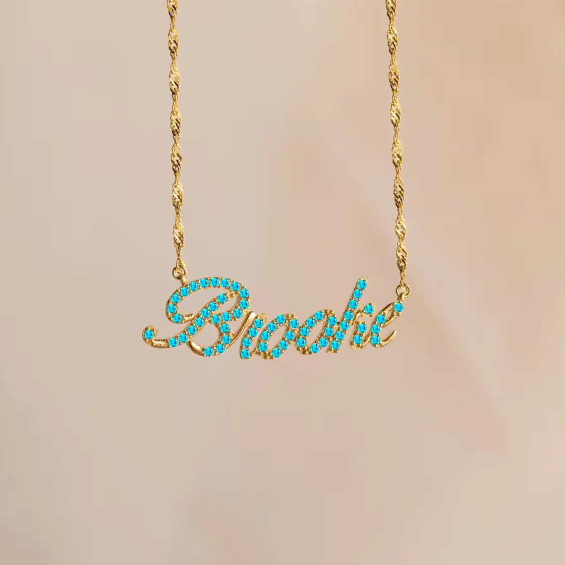 Customised copper geometric name necklace for women in gold finish on white background