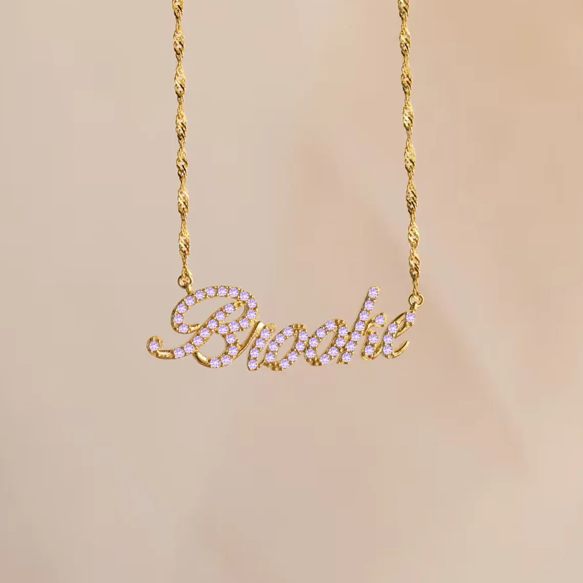 Customised copper geometric name necklace for women in gold finish on white background