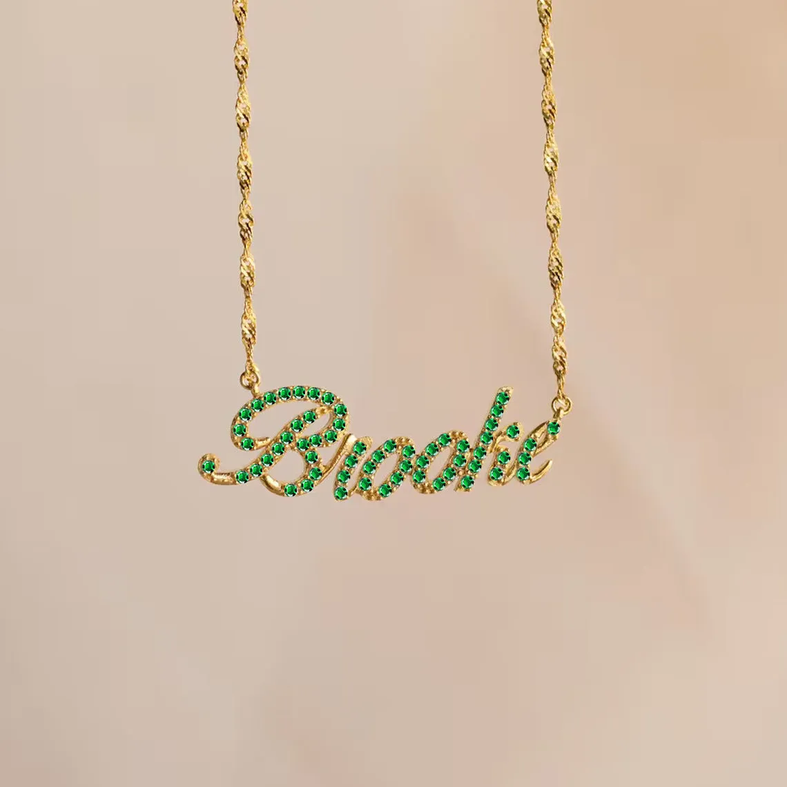 Customised copper geometric name necklace for women in gold finish on white background