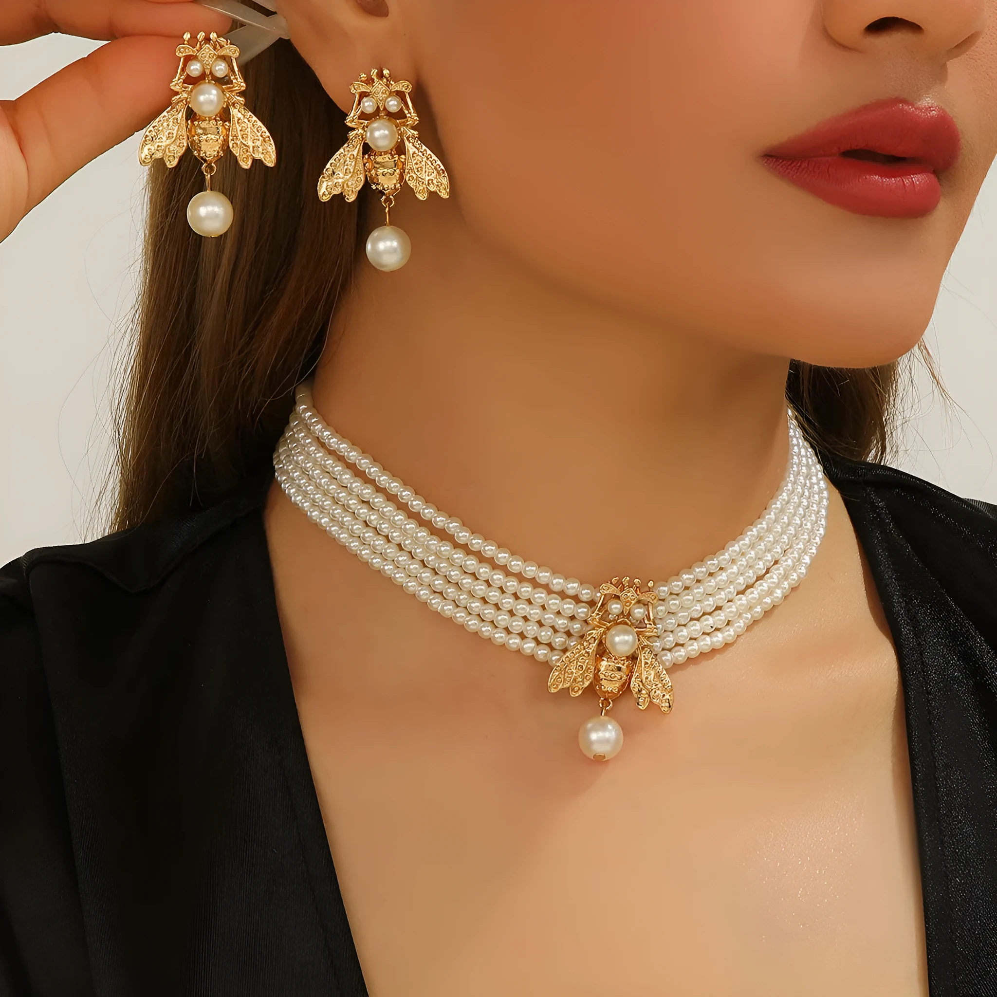 Golden bee earrings and necklace set on display with alloy pendant and regular chain