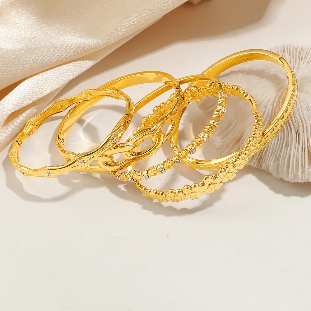 Titanium steel 18K gold electroplated bracelet with round zircon accents in SZ67 Gold colour on a plain background
