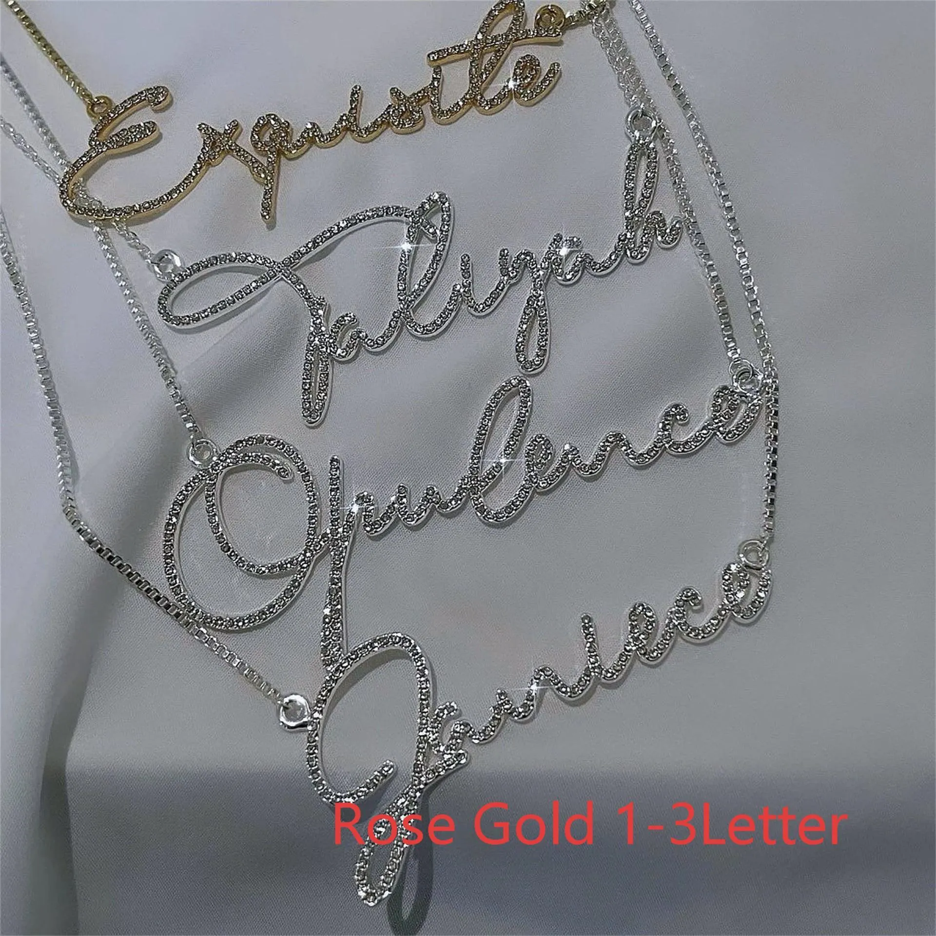 Personalised stainless steel name necklace with diamond-studded letters in silver, shown at an adjustable length.