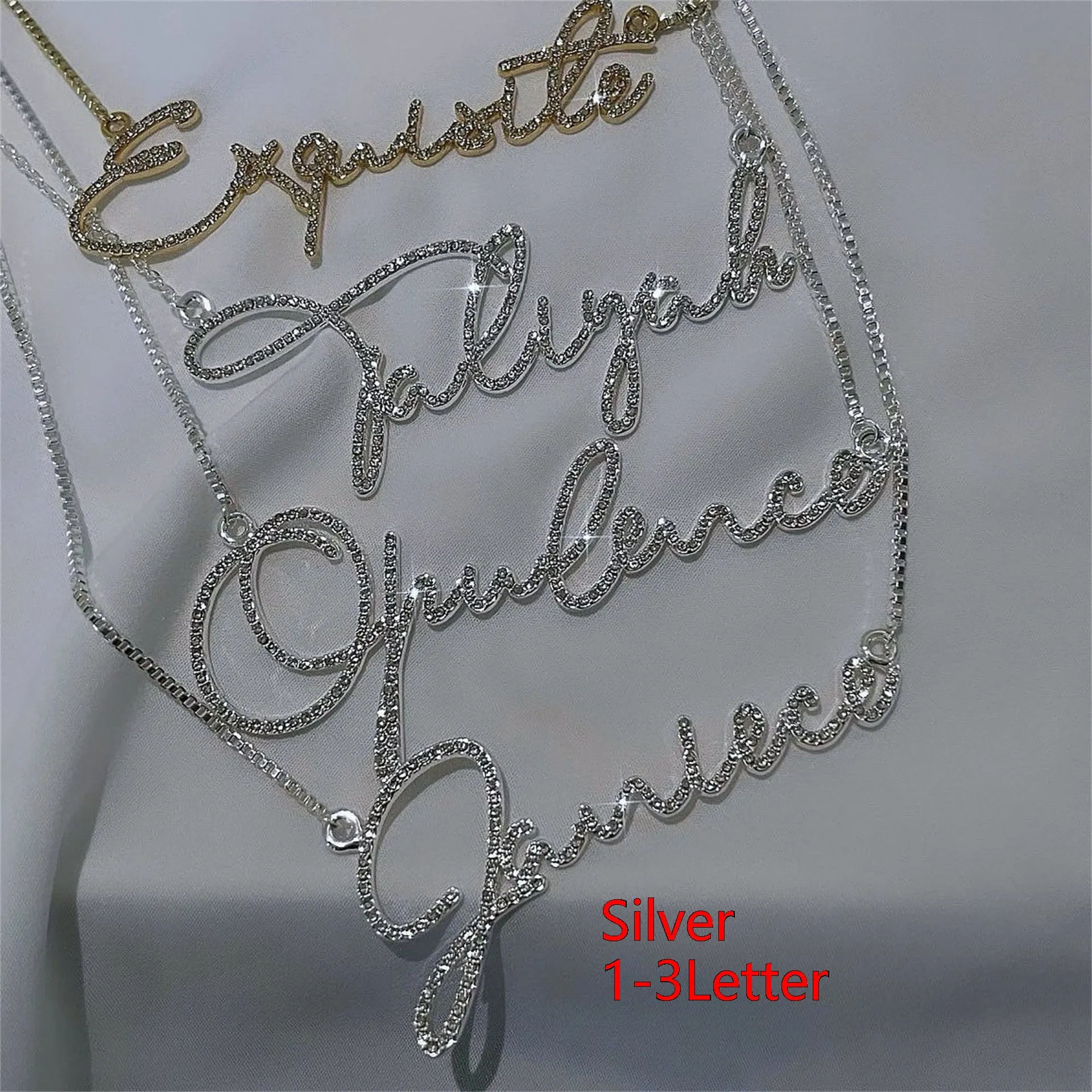 Personalised stainless steel name necklace with diamond-studded letters in silver, shown at an adjustable length.