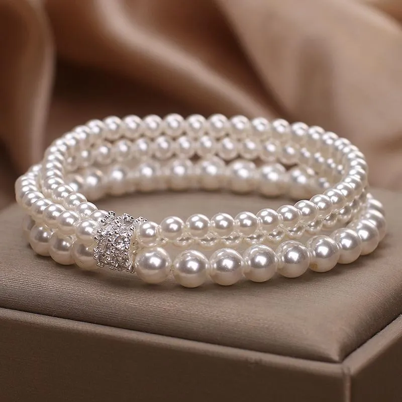 Baroque pearl multi-layer twin bracelet in white with electroplated finish on neutral background