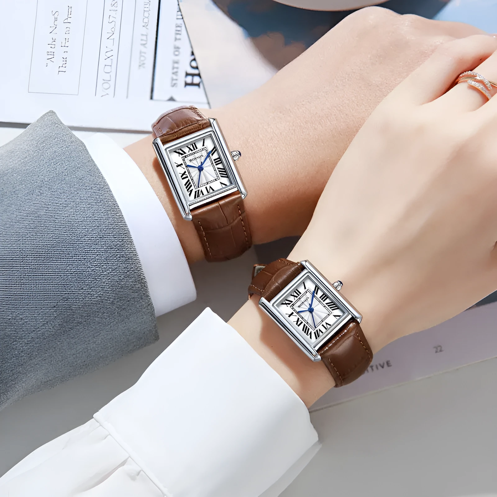 Couple leather watch with square dial, 7mm thickness, waterproof, in gold and black colour option on a white background