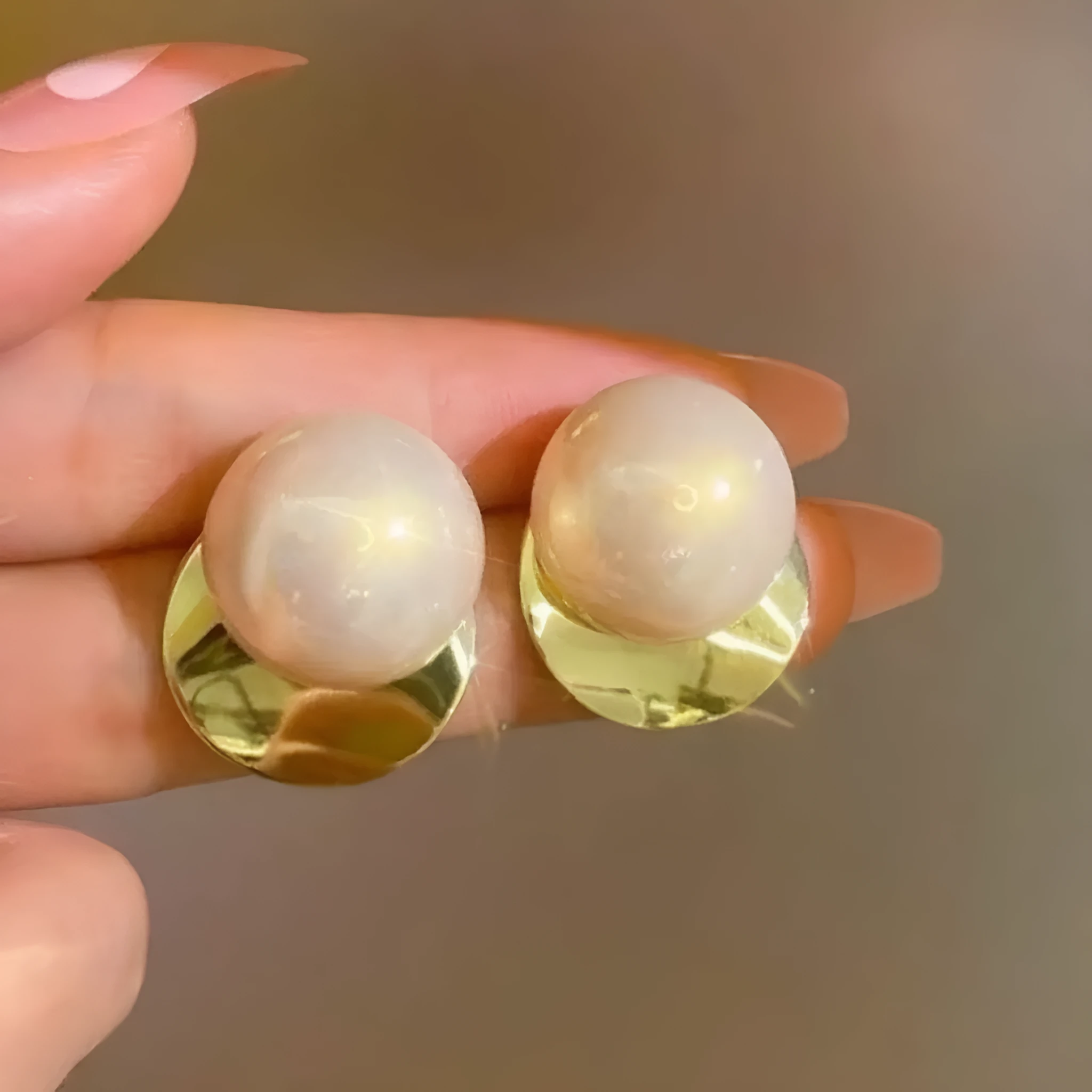 Fashionable alloy round drop earrings in gold tone, 1.2 cm diameter, on a white background