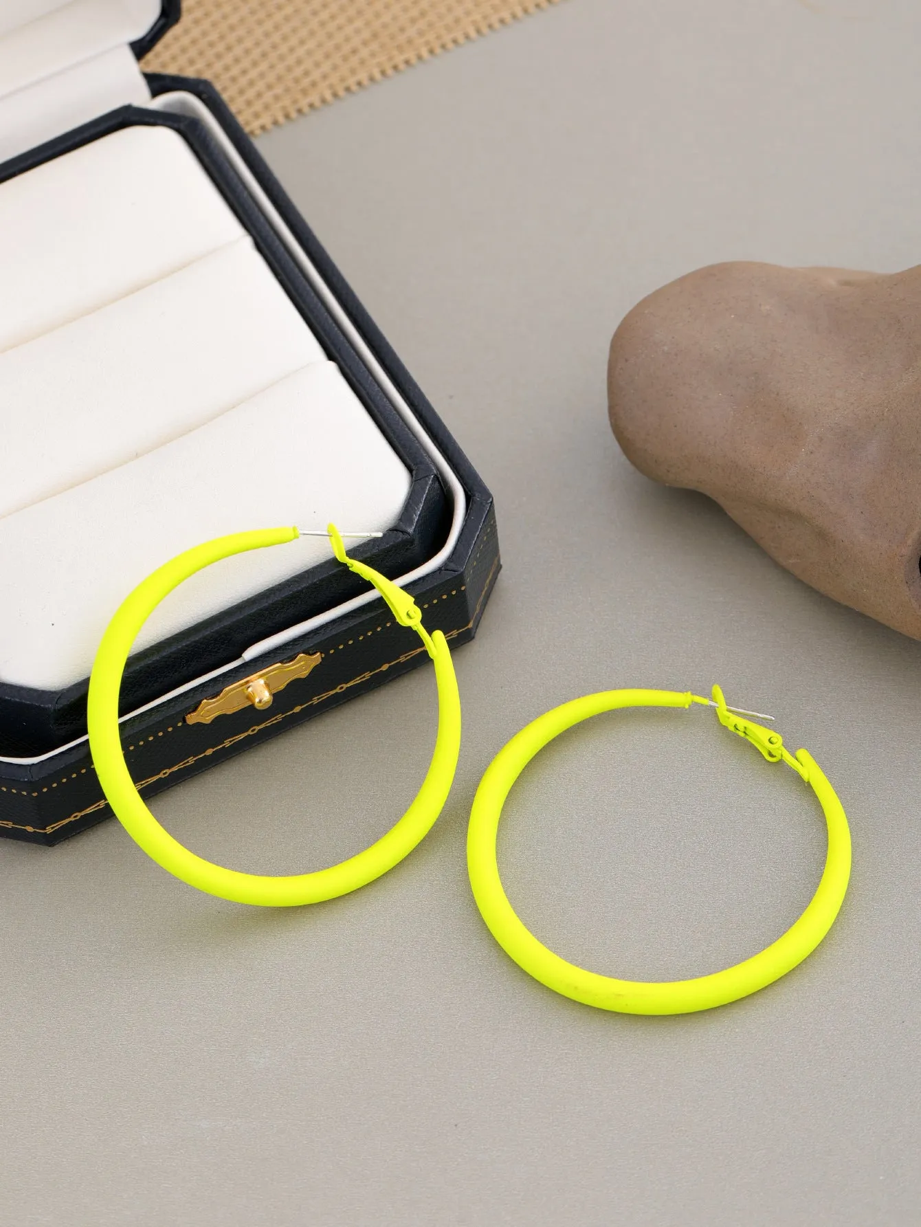 Two tone gradient exaggerated circle earrings on display showing colour transition and hoop shape