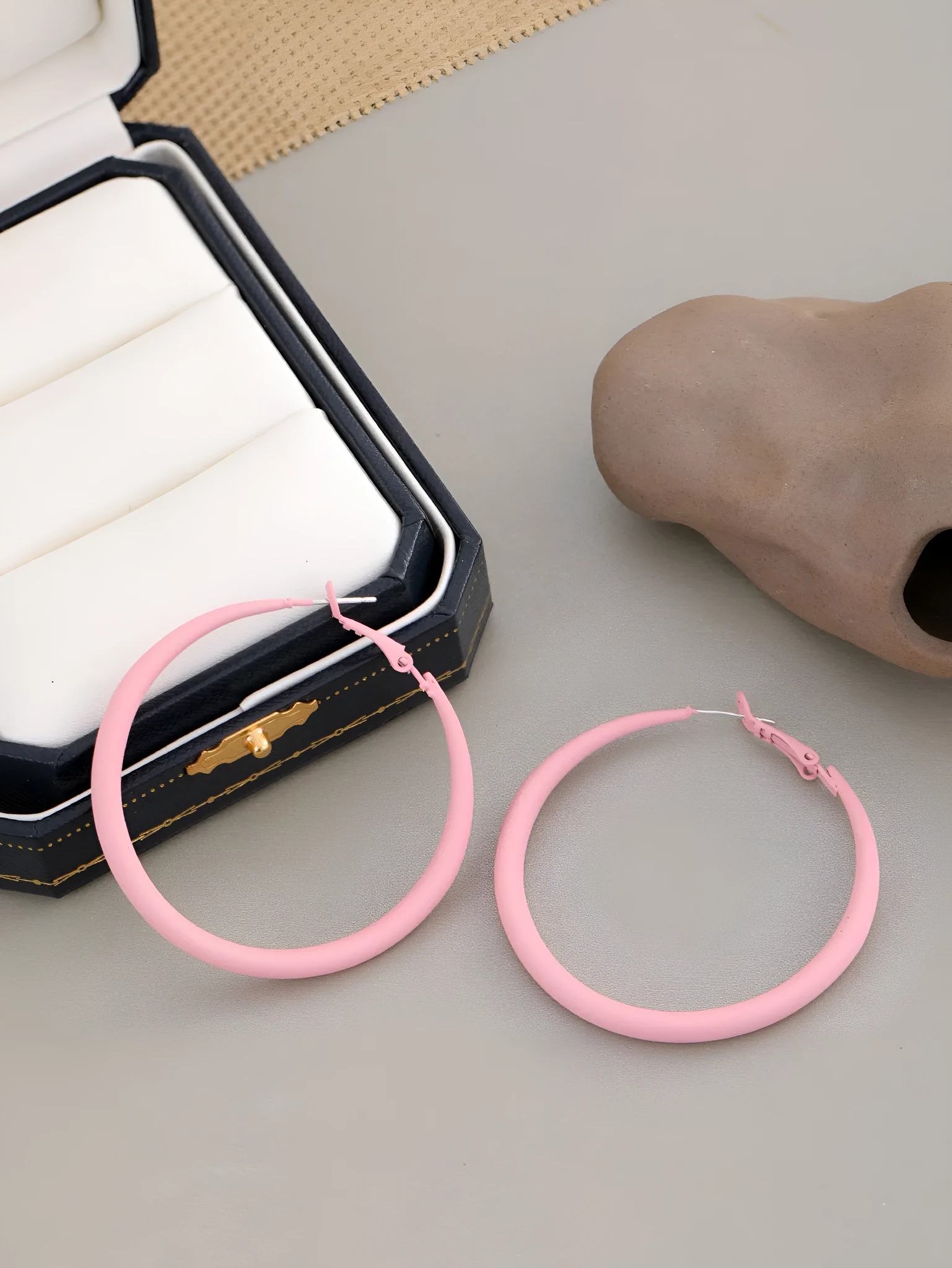 Two tone gradient exaggerated circle earrings on display showing colour transition and hoop shape