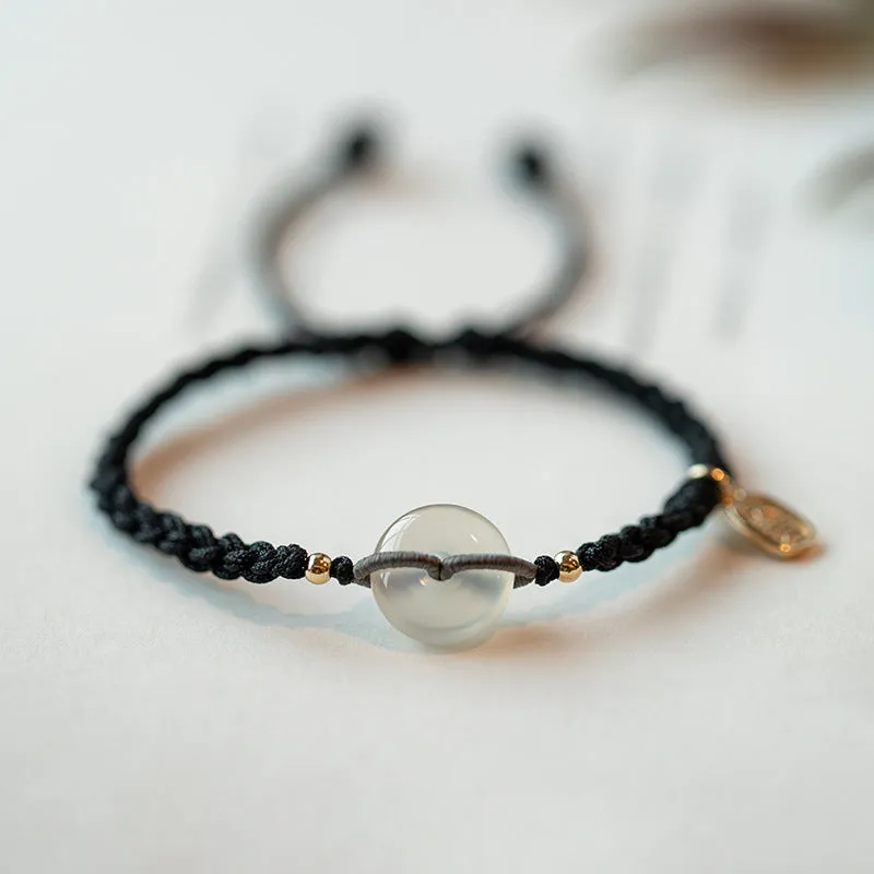 Woven crystal bracelet with flower motifs and ethnic design in black or double colour rope
