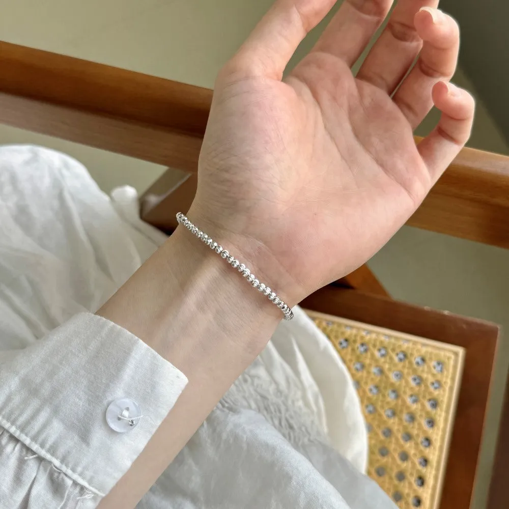 S925 sterling silver bracelet for women with crescent and round beads in geometric design, platinum finish, on white background