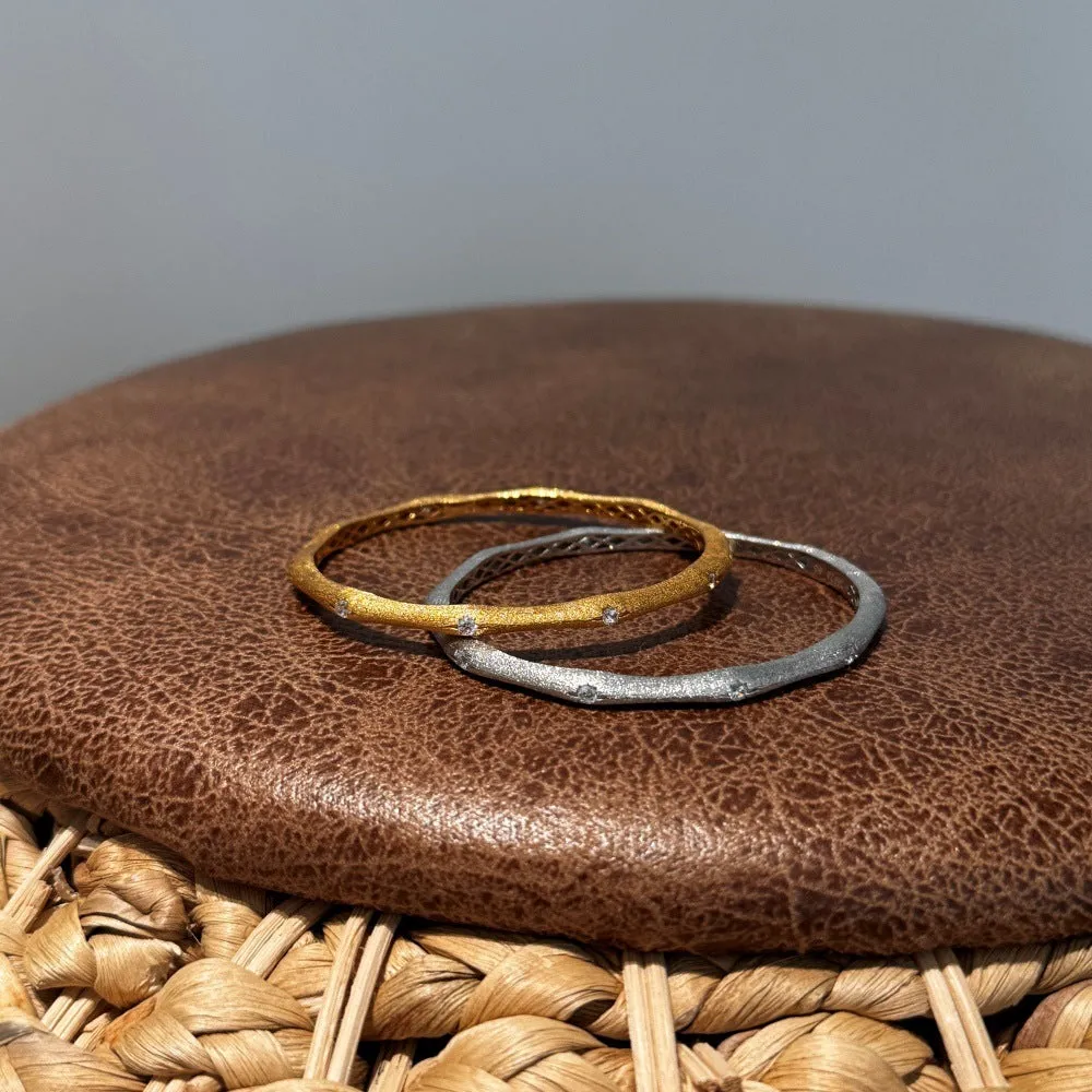 925 silver gold finish wire drawing bracelet with zircon inlay on white background
