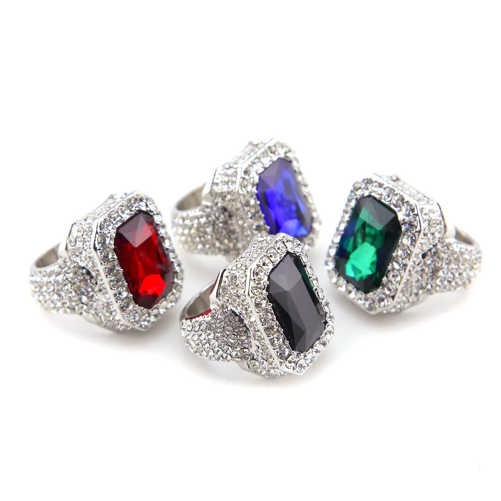 Gold-plated men's hip hop ring with emerald colour, geometric asymmetric design, and diamond treatment