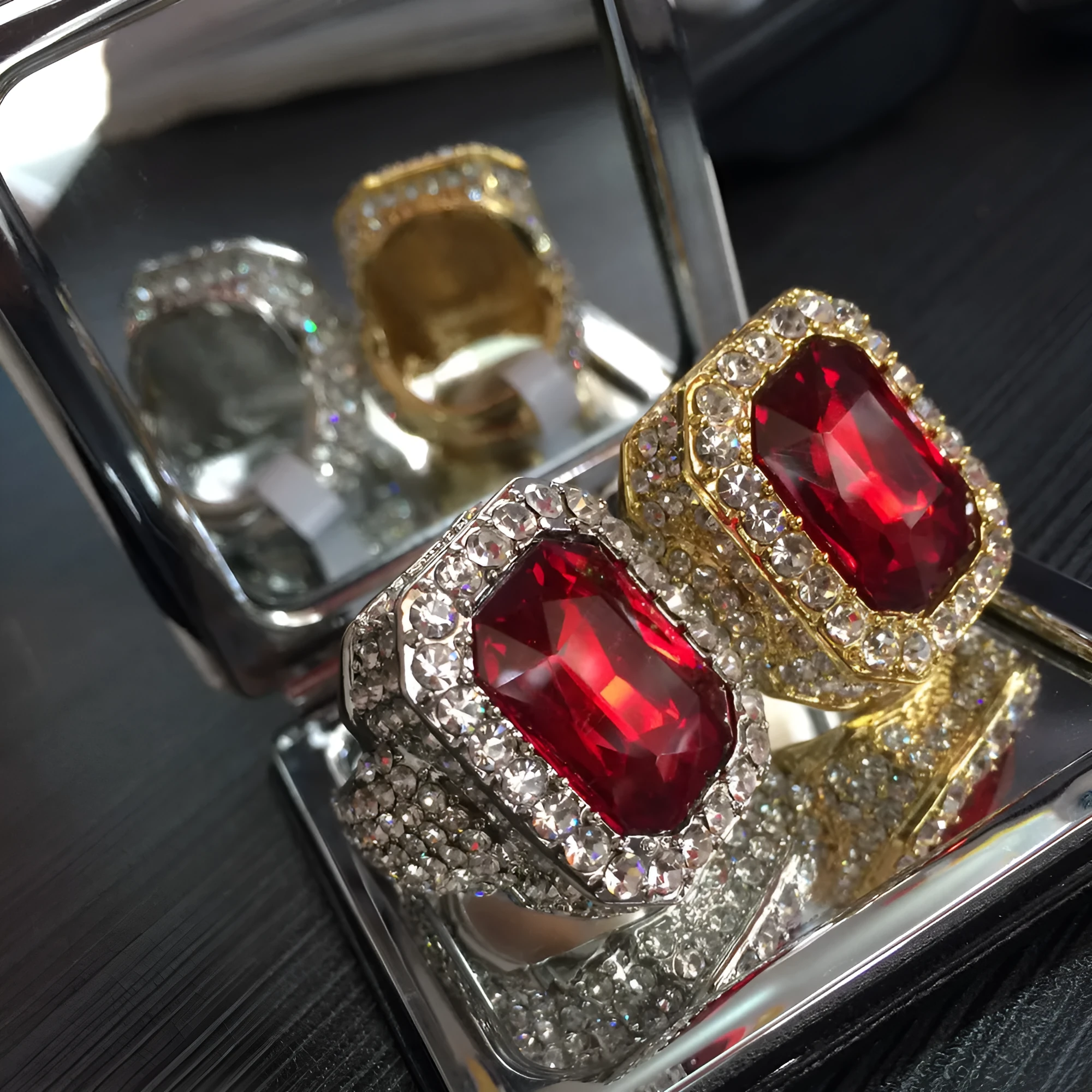 Gold-plated men's hip hop ring with emerald colour, geometric asymmetric design, and diamond treatment