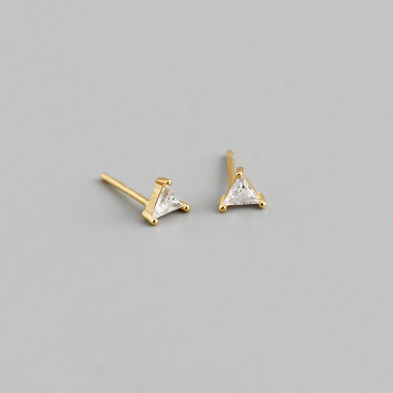 Simple triangle colour zircon stud earrings in 925 sterling silver with blue stone and gold needle on white background