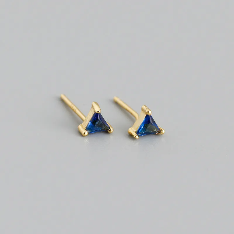 Simple triangle colour zircon stud earrings in 925 sterling silver with blue stone and gold needle on white background