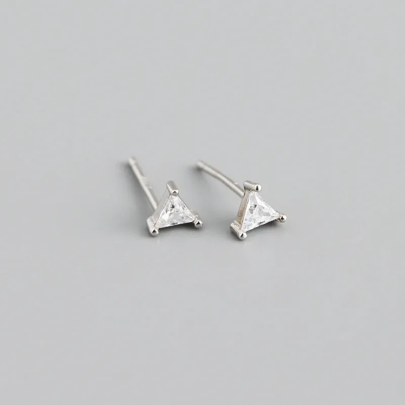 Simple triangle colour zircon stud earrings in 925 sterling silver with blue stone and gold needle on white background