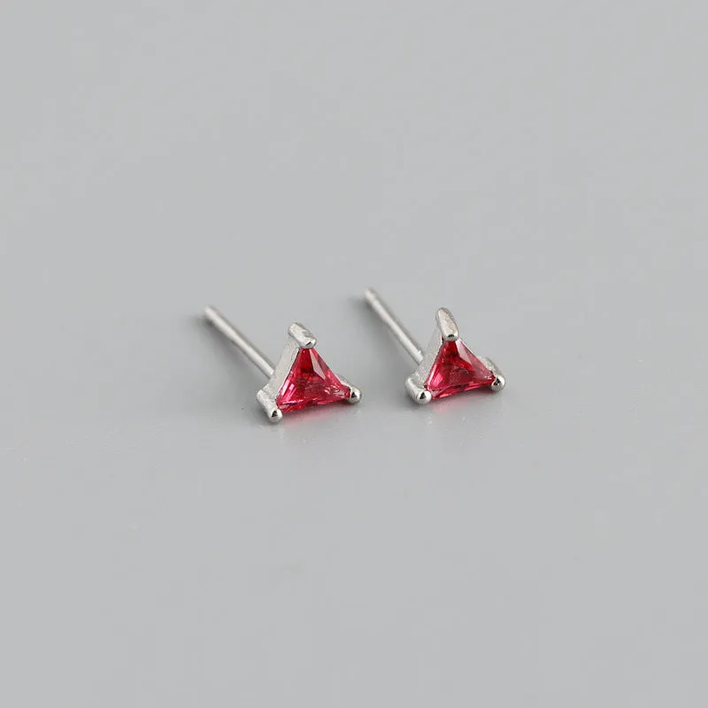 Simple triangle colour zircon stud earrings in 925 sterling silver with blue stone and gold needle on white background