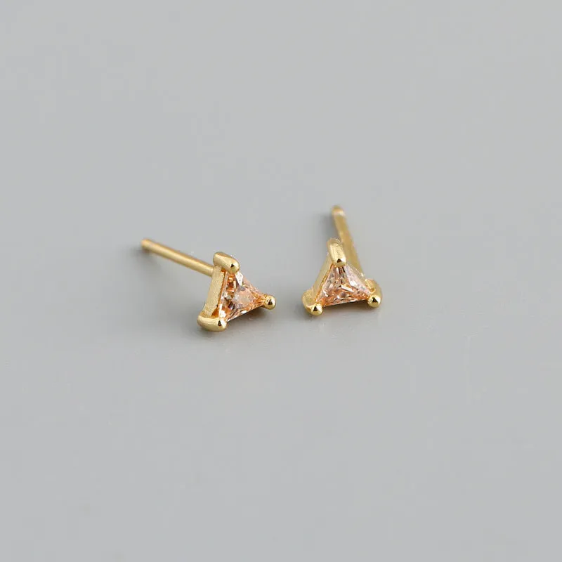 Simple triangle colour zircon stud earrings in 925 sterling silver with blue stone and gold needle on white background