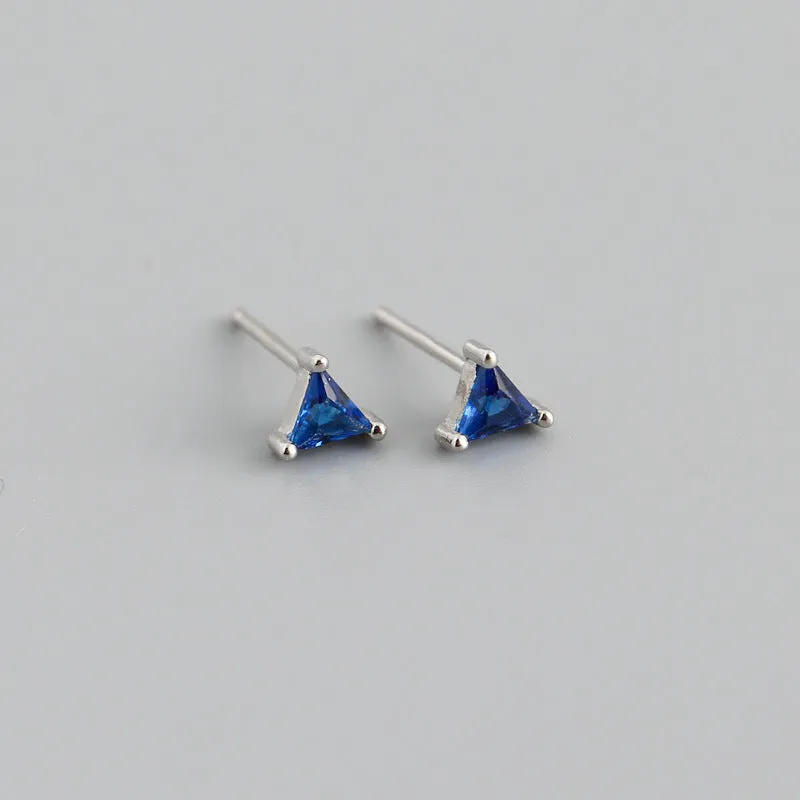 Simple triangle colour zircon stud earrings in 925 sterling silver with blue stone and gold needle on white background