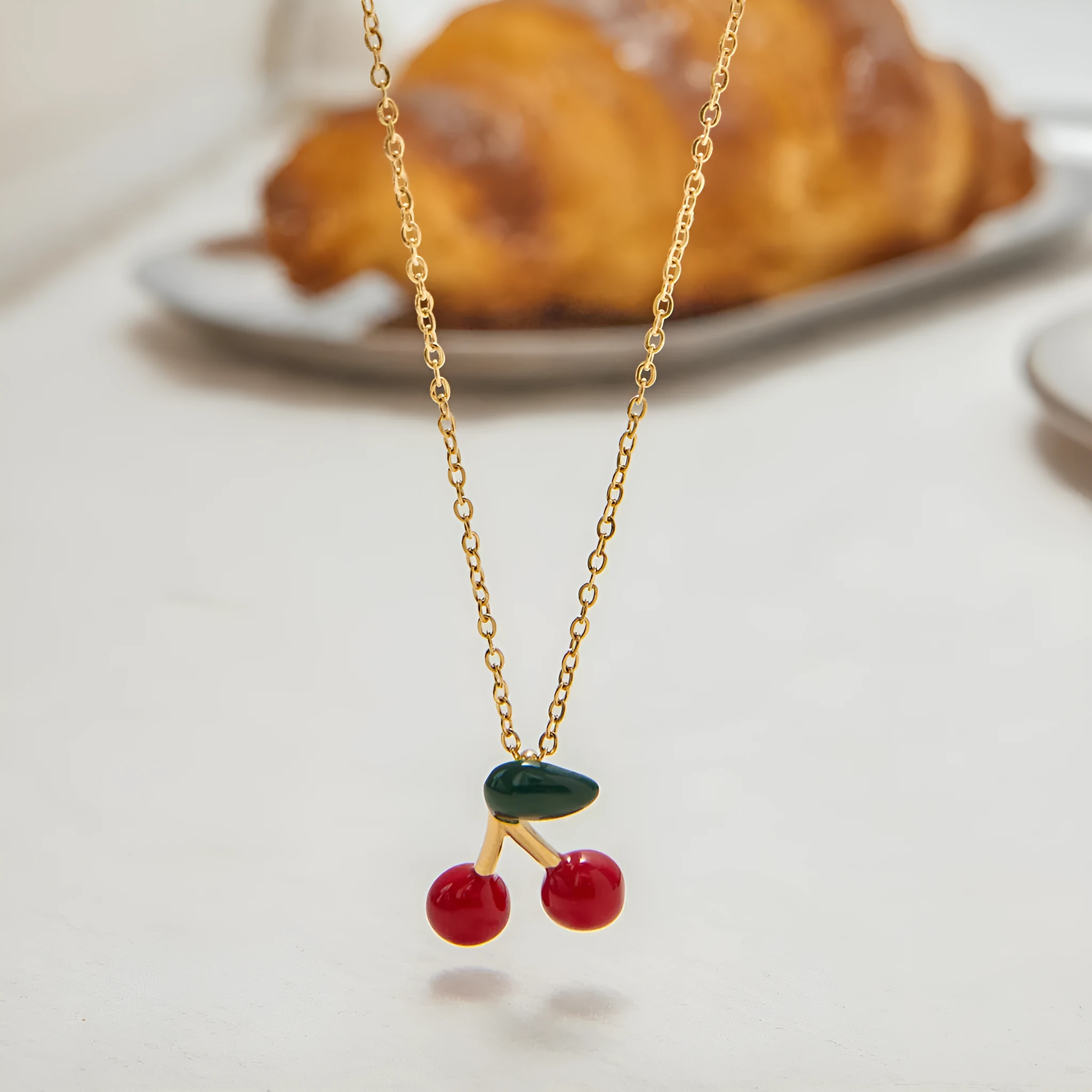 Stainless steel cherry-shaped pendant necklace with titanium steel finish on a regular chain, available in JDN0303030-1 colour