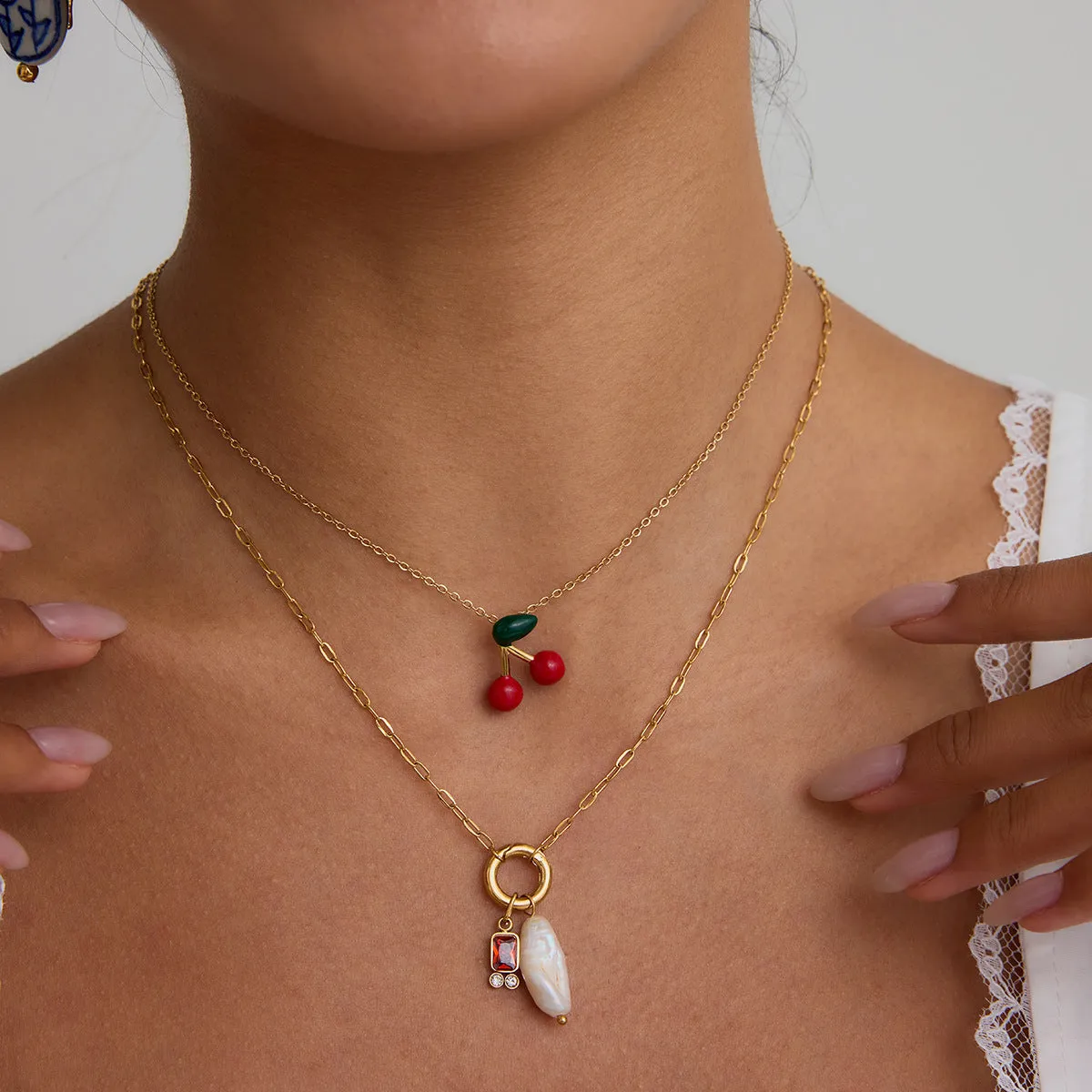 Stainless steel cherry-shaped pendant necklace with titanium steel finish on a regular chain, available in JDN0303030-1 colour