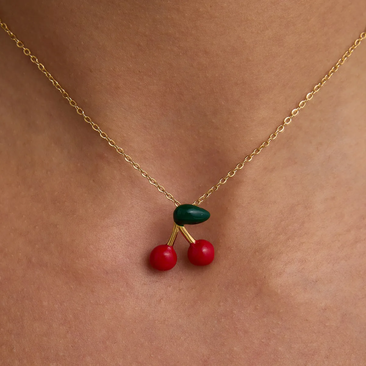 Stainless steel cherry-shaped pendant necklace with titanium steel finish on a regular chain, available in JDN0303030-1 colour